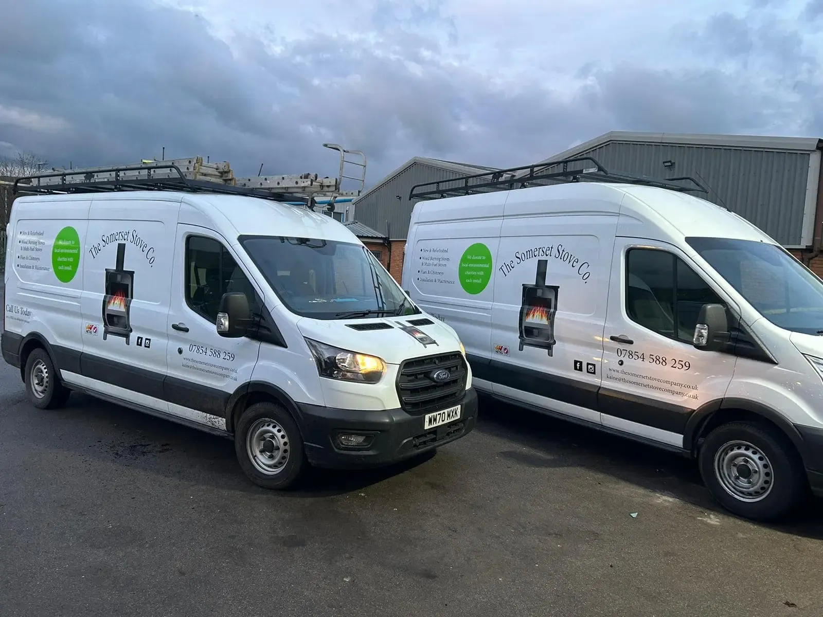 The Somerset Stove Company's two branded vans